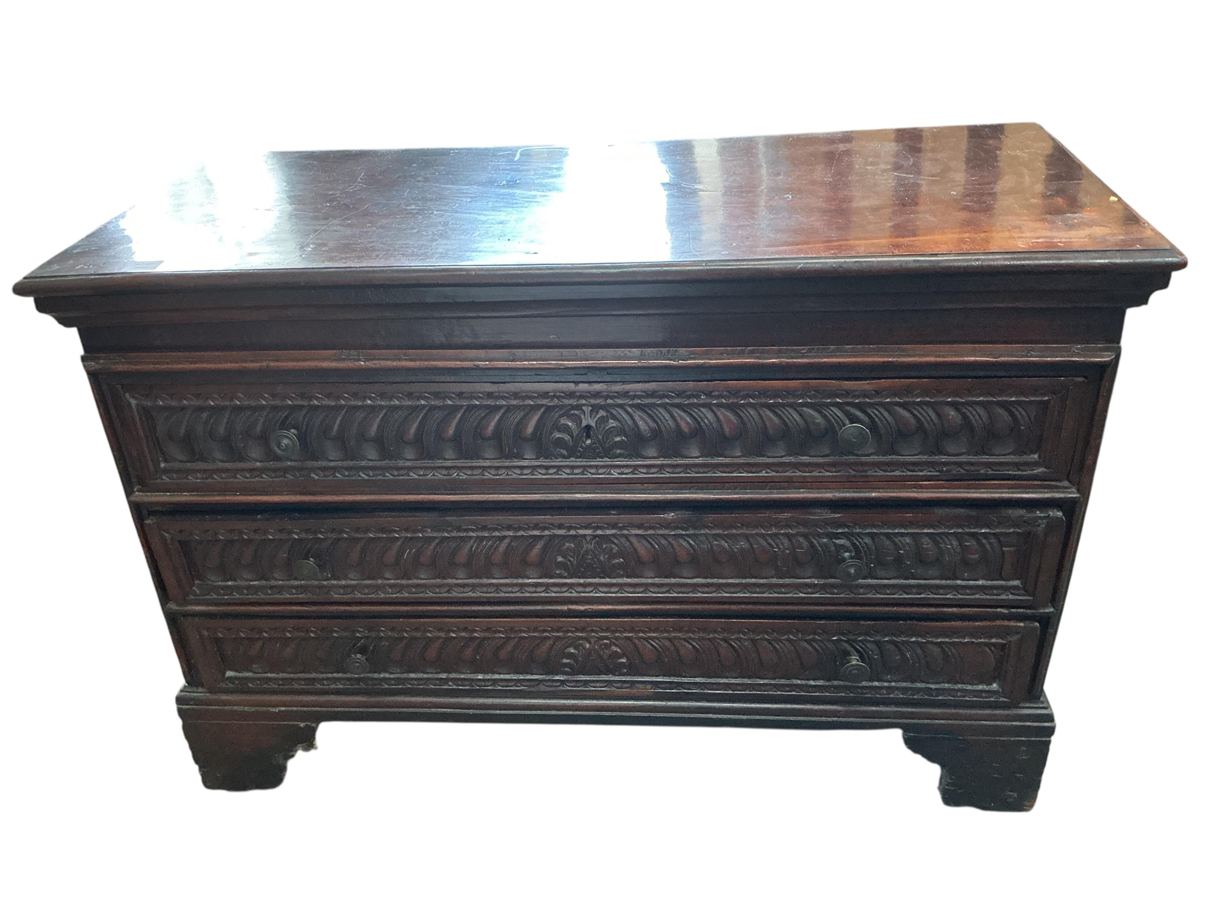 An 18th century Continental carved walnut chest, width 131cm, depth 56cm, height 88cm